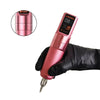 Gloved hand holding a pink wireless tattoo pen with six adjustable stroke settings for lining, shading, and color packing.