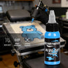 Blue tattoo ink 1 oz bottle displayed with tattoo machine at an artist workstation | GTARTISTOO