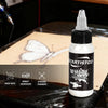 White tattoo ink 1 oz bottle displayed with a white butterfly tattoo design on practice skin | GTARTISTOO